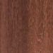 Close-up of a wooden surface with a rich brown color and visible grain pattern.